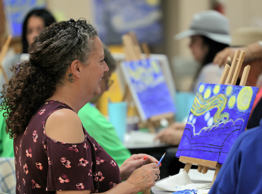Starry Night Paint and Sip participant creates a masterpiece